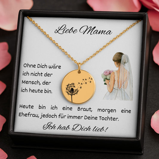 Eine gold Halskette mit runden Anhänger, auf dem eine fein gravierte Windblume abgebildet ist, liegt auf einer weißen Grußkarte in einer schwarzen Schmuckbox. Die Karte trägt die Nachricht: „Liebe Mama – Ohne Dich wäre ich nicht der Mensch, der ich...“ Daneben ist eine zarte Illustration einer Braut. Die 18K vergoldete Edelstahlkette ist 45 cm lang mit 5 cm Verlängerung. Ein emotionales Dankeschön-Geschenk für die Mutter der Braut, liebevoll verpackt und bereit zum Verschenken.