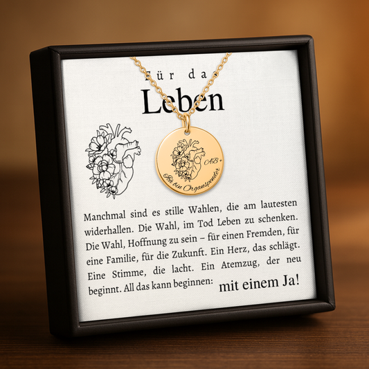 Halskette mit runden Anhänger aus Edelstahl in 18k Gelb Gold, fein graviertes Blättchen-Symbol für Organspende. Personalisierbare Gravur auf der Rückseite. Verstellbare Kette in Stahlsilber, 18K vergoldet oder rosé vergoldet. Inklusive Grußkarte mit symbolischem Text zur Organspende. Ideal als Danke schön Geschenk, Mutmacher oder Symbol für Leben retten.