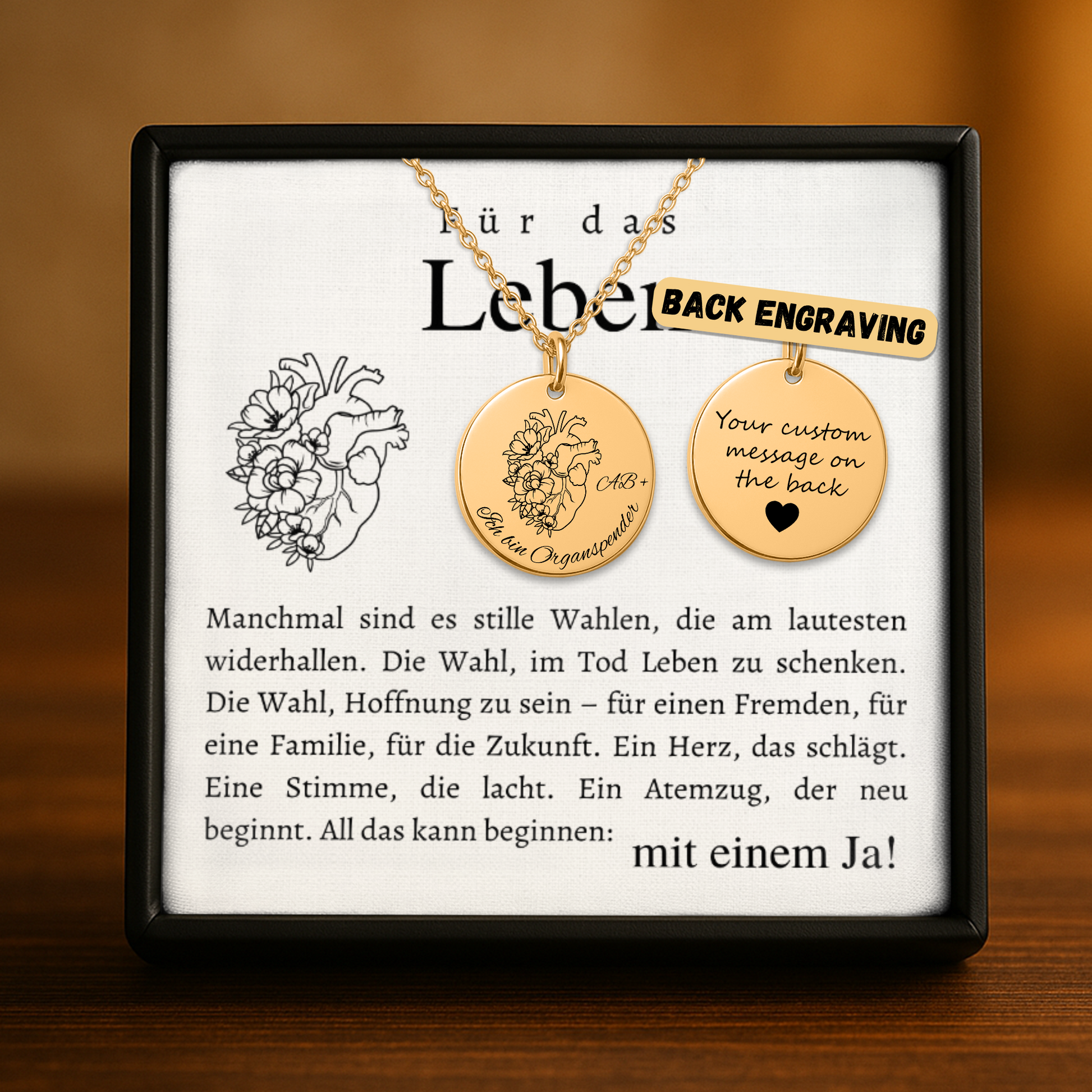 Halskette mit runden Anhänger aus Edelstahl in 18k Gelb Gold, fein graviertes Blättchen-Symbol für Organspende. Personalisierbare Gravur auf der Rückseite. Verstellbare Kette in Stahlsilber, 18K vergoldet oder rosé vergoldet. Inklusive Grußkarte mit symbolischem Text zur Organspende. Ideal als Danke schön Geschenk, Mutmacher oder Symbol für Leben retten.